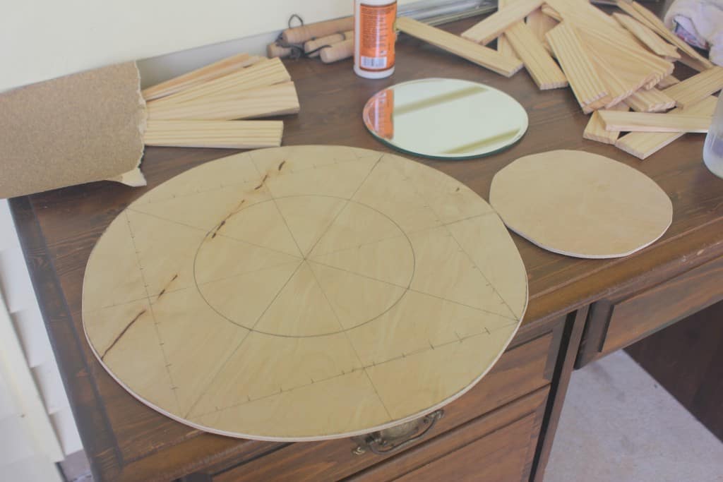a large and a small circle cut out of plywood for a diy mirror project - Mid-Century Modern Mirror - Life Full and Frugal