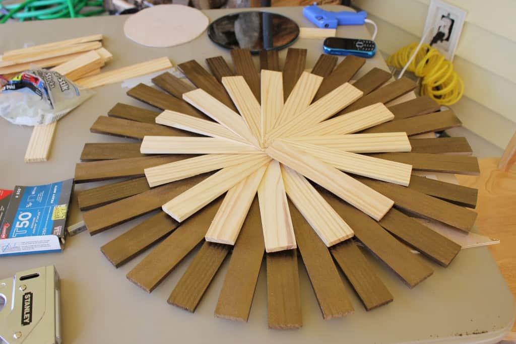 DIY mid-century modern sunburst mirror made with wood shims, some spray painted bronze, some unpainted wood - Mid-Century Modern Mirror