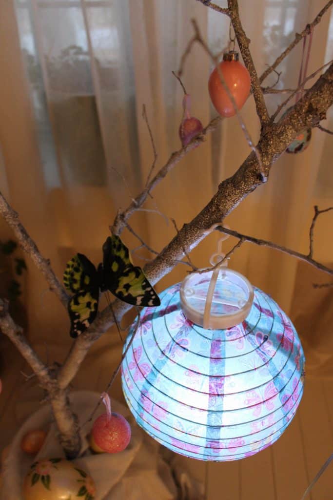 Lantern and butterfly on an Easter tree