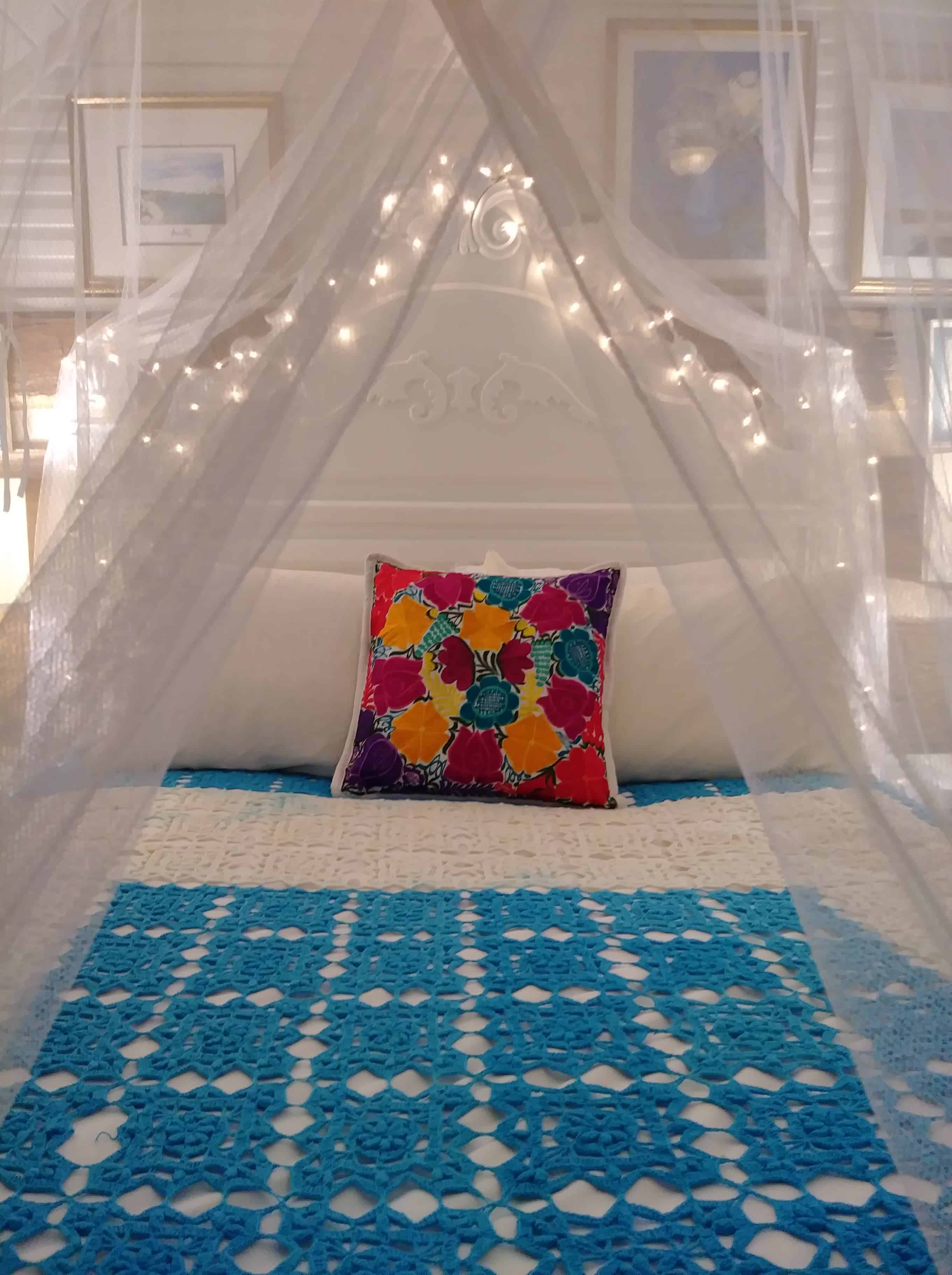 canopy and white lights on a bed