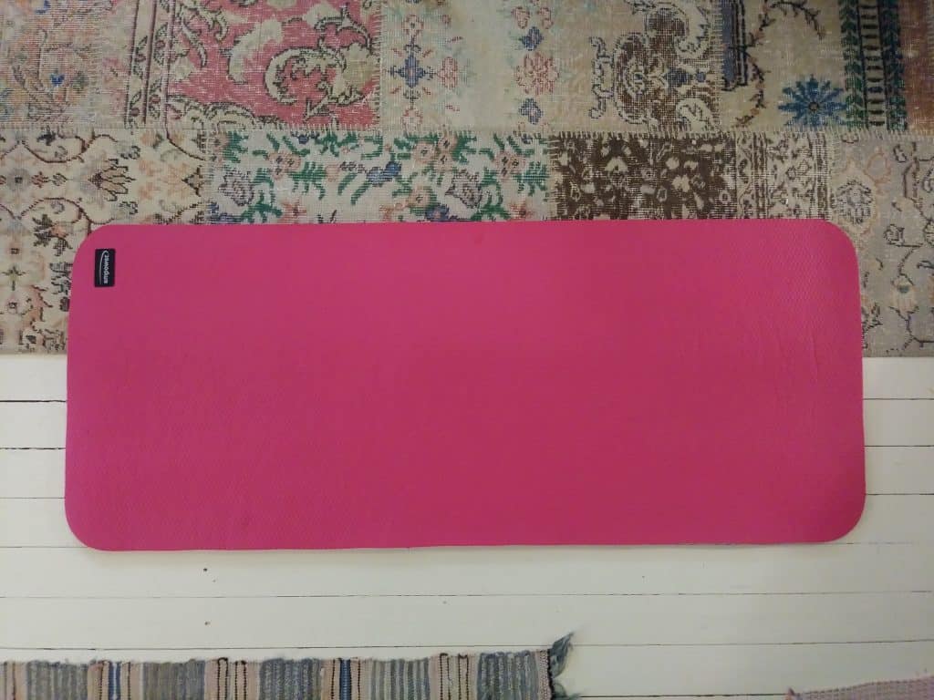 a pink yoga mat on the living room floor life full and frugal