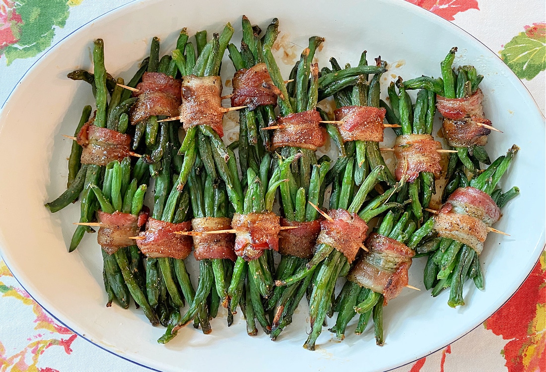 dru holland cast iron enamel baking dish filled with bacon wrapped green bean bundles - Life Full and Frugal