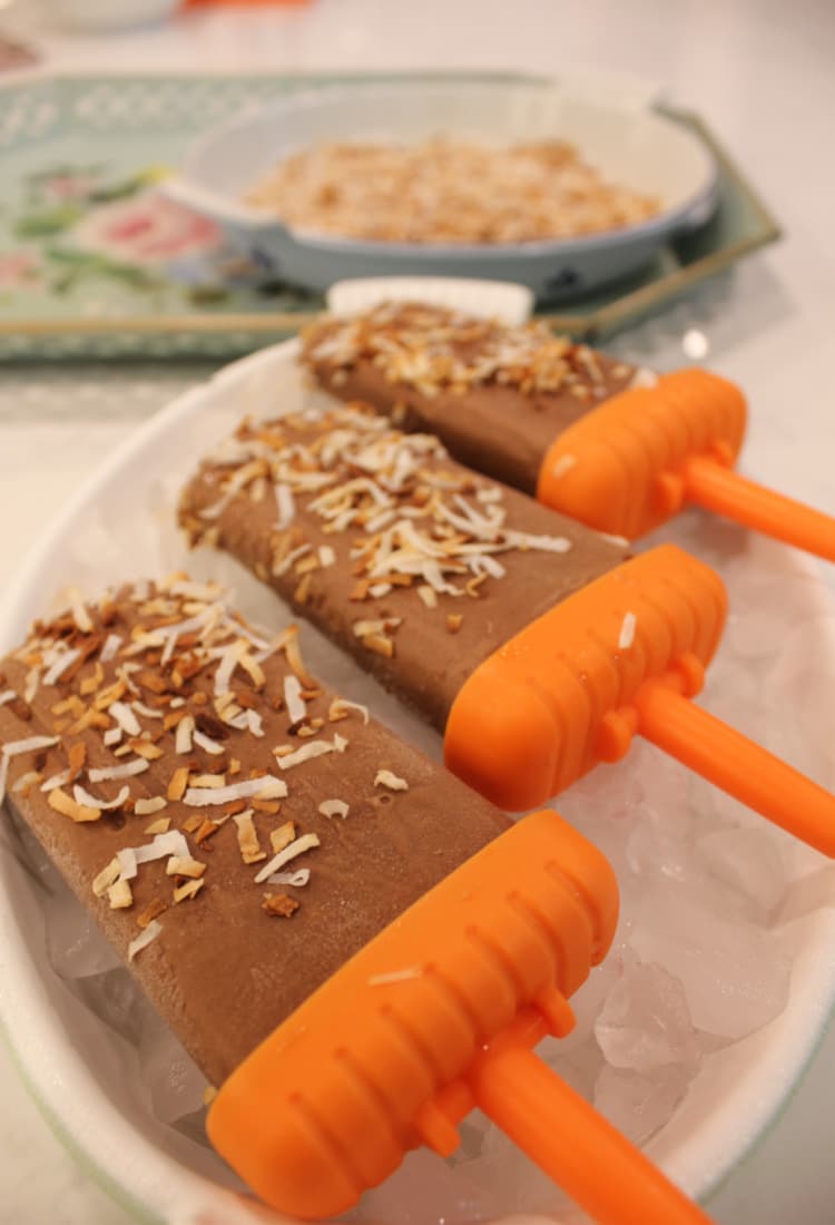 a line of coconut and chocolate popsicles on ice life full and frugal