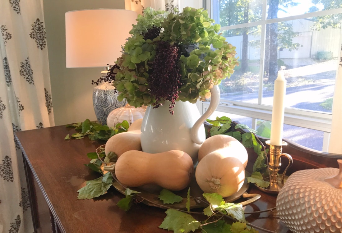 Creating Frugal Eclectic Fall Decor- Life Full and Frugal - floral arrangement of hydrangeas and winged sumac berries surrounded by butternut squash