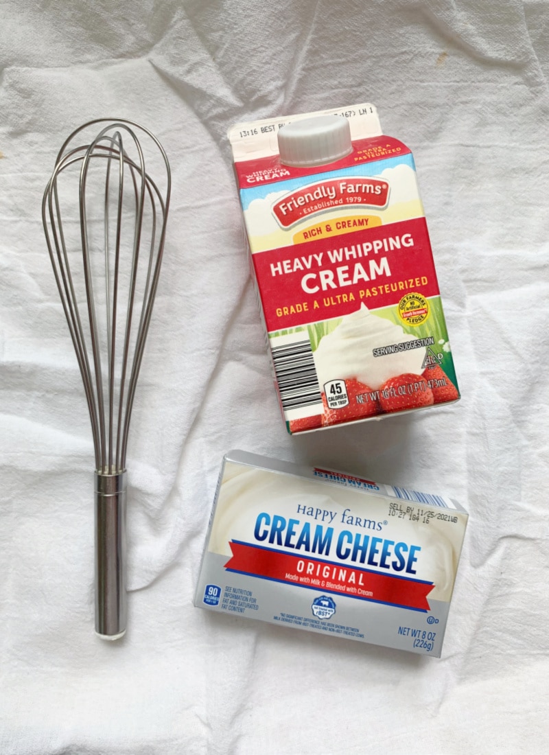 cream and cream cheese with a whisk