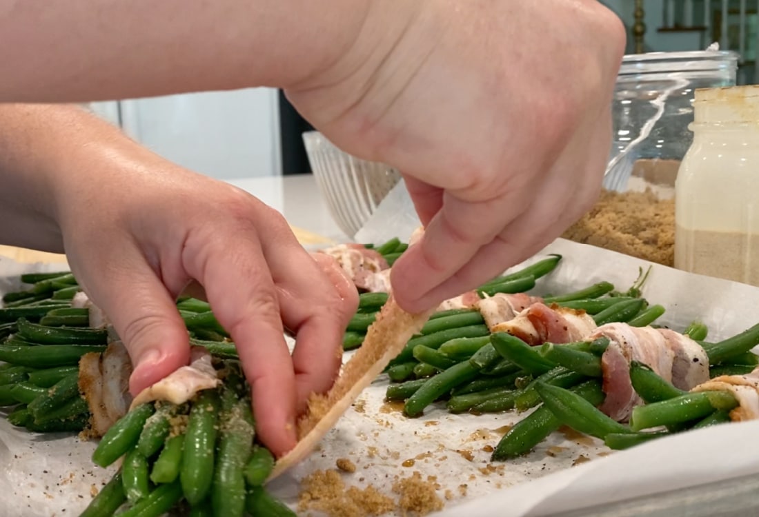 wrapping green bean bundles with bacon - Life Full and Frugal