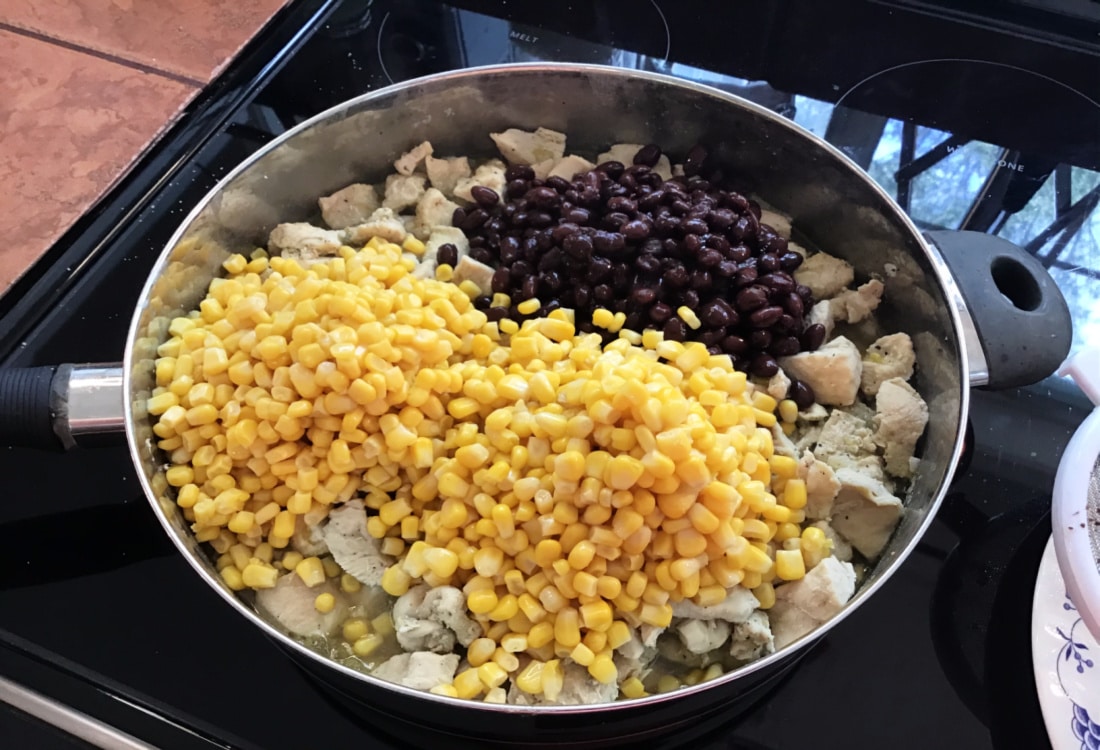 easy weeknight chicken tacos chicken in a pan with corn and black beans life full and frugal