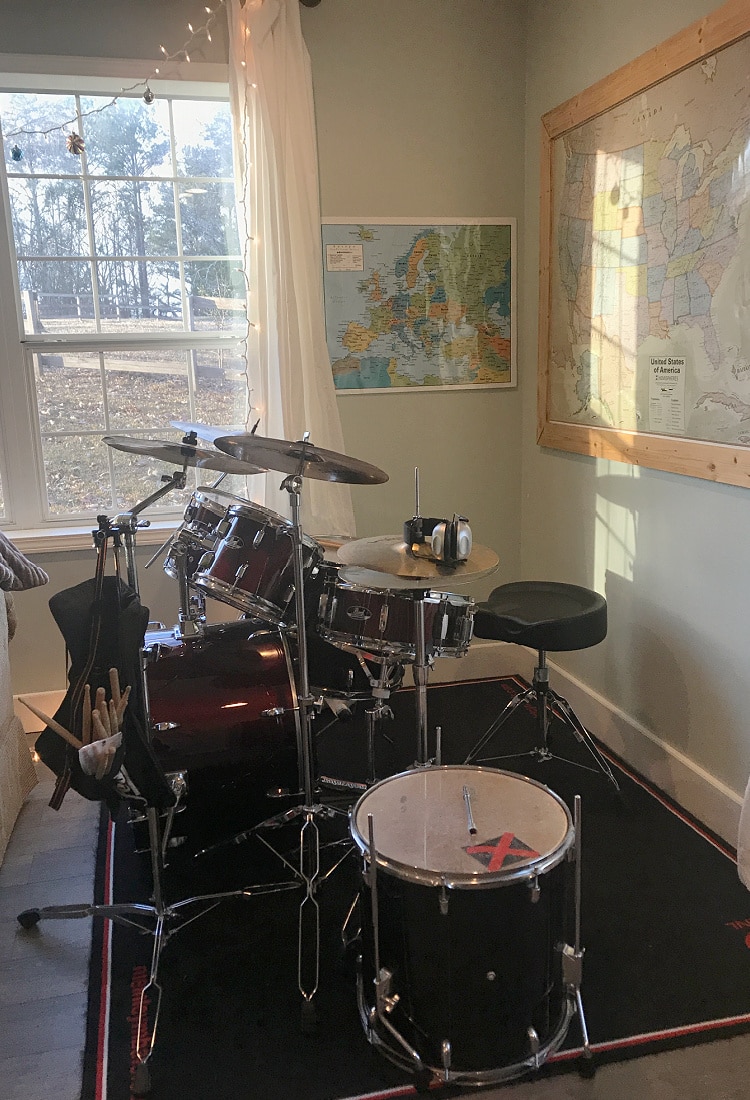 drum set by a window with maps on the walls around it -Homeschool Classroom Overhaul and Tour - Life Full and Frugal